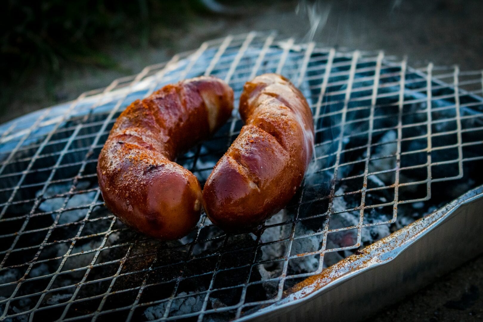 two-sausages-on-charcoal-grill-1275692